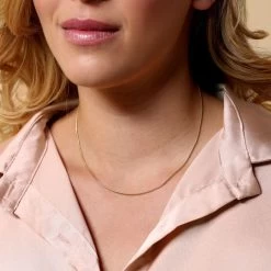 9ct Yellow Gold Plated 1.2mm Snake Chain Necklace 6 9ct Yellow Gold Plated 1.2mm Snake Chain Necklace -Fashion Accessories Store gold plated sterling silver snake chain female model close view tchygrsn12 2000q6