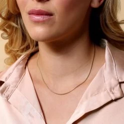 9ct Yellow Gold Plated 1.4mm Snake Chain Necklace 12 9ct Yellow Gold Plated 1.4mm Snake Chain Necklace -Fashion Accessories Store gold plated sterling silver snake chain female model close view tchygrsn14 2000q6